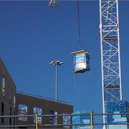 Image of a Bathroom Pods being lowered down to the ground ready for installation.