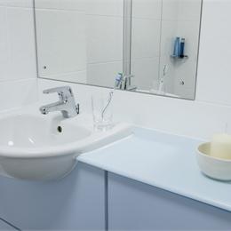 Close Up View of Sink and Mirror in Bathroom Pod